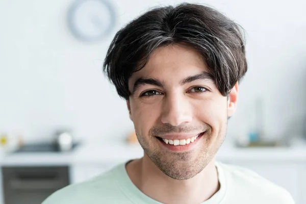Portrait of happy brunette man looking at camera — Stock Photo