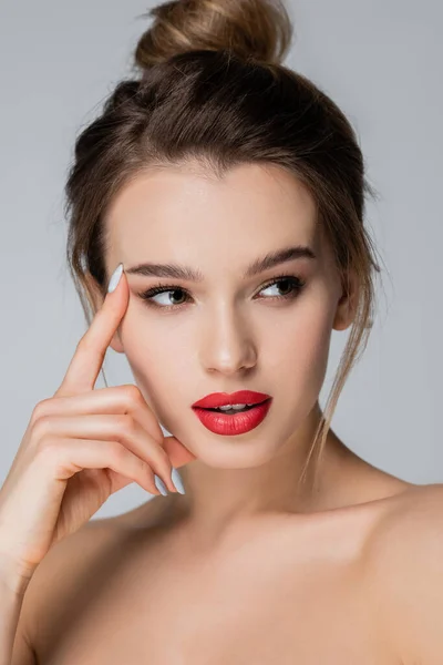 Young and pretty woman with red lips looking away isolated on grey — Stock Photo