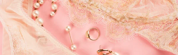 Top view of accessories near lace underwear on pink background, banner — Stock Photo