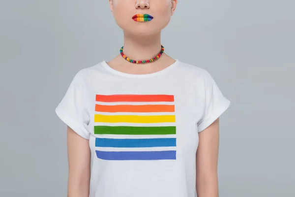 Cropped view of woman in necklace and t-shirt with rainbow colors isolated on grey — Stock Photo