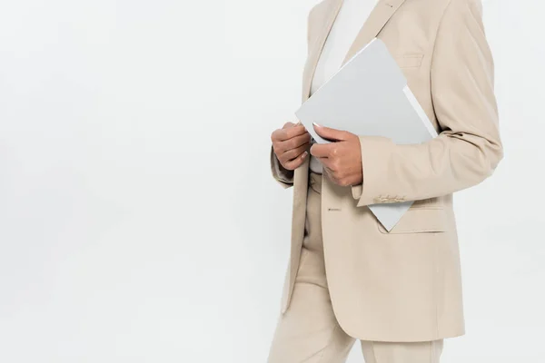 Cropped view of businesswoman in suit holding paper folder isolated on grey — Stock Photo