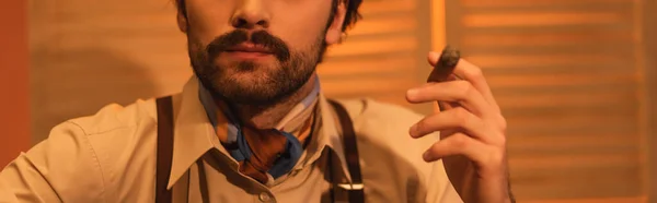 Cropped view of man with mustache holding cigar, banner — Stock Photo