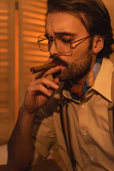 Portrait of man with mustache and eyeglasses smoking cigar — Stock Photo