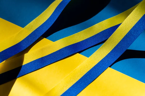 Close up view of blue and yellow ribbon on ukrainian flag — Stock Photo