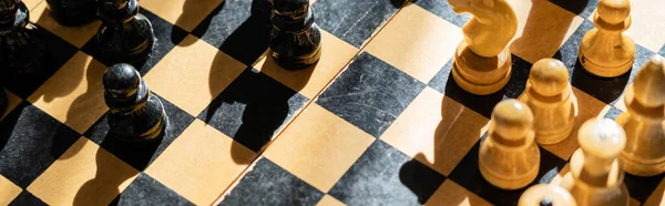 Top view of chess on chessboard with shadow, banner — Stock Photo