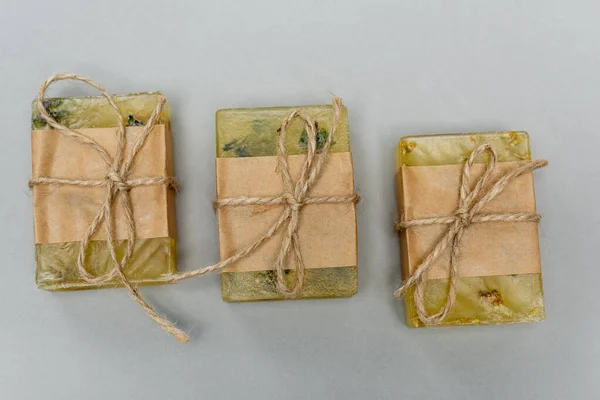 Top view of handmade soap on grey background — Stock Photo