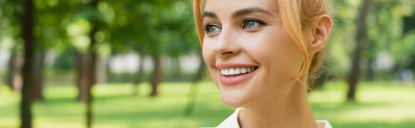 Portrait of pretty cheerful woman looking away outdoors, banner — Stock Photo