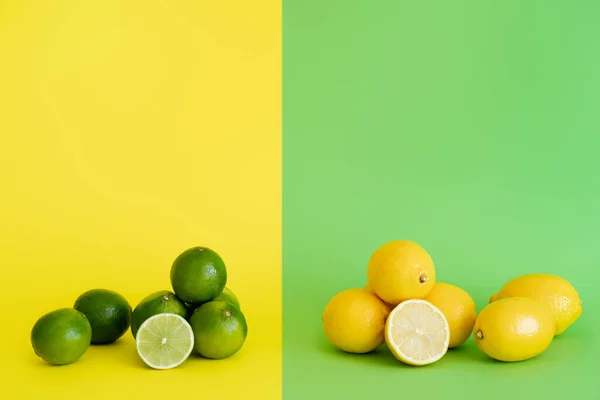 Whole and cut of limes and lemons on green and yellow background — стоковое фото