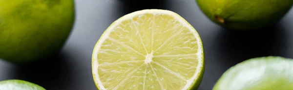 Close up view of half of juicy lime on black background, banner — Fotografia de Stock