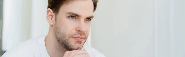 Portrait of young and dreamy man looking away, banner — Stock Photo