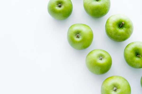 Top view of rows with delicious apples on white — Stock Photo