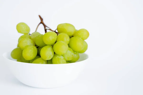 Fresh and green grapes in bowl on white — Stock Photo