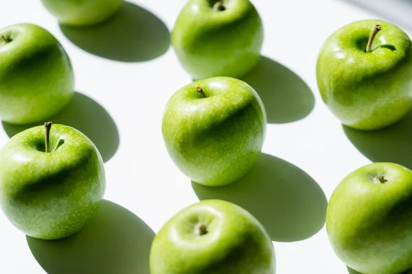 Close up of green tasty apples on white — Stock Photo