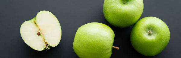 Top view of juicy and green apples on black, banner — Stock Photo