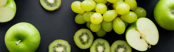 Top view of green ripe fruits on black, banner — Stock Photo