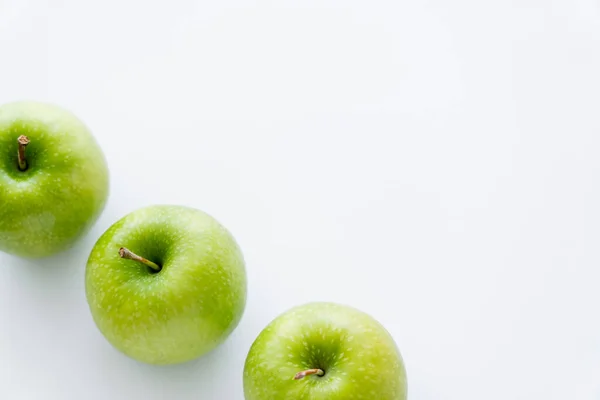 High angle view of tasty whole apples on white — Stock Photo