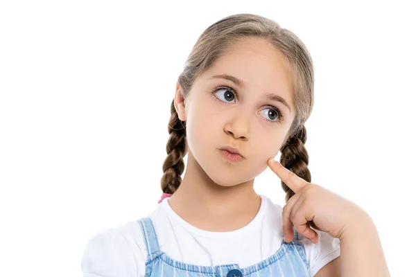 Chica pensativa con trenzas tocando la cara y mirando hacia otro lado aislado en blanco — Stock Photo