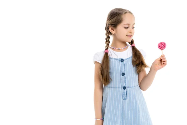 Happy girl with braids holding lollipop isolated on white — Stock Photo