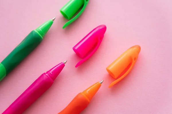 Top view of bright and colorful pens on pink — Stock Photo