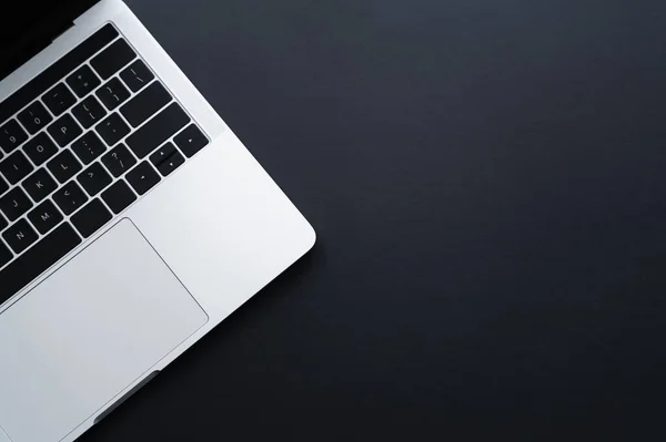 Top view of modern laptop on black — Stock Photo