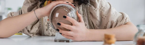 Cropped view of medium holding magic orb at home, banner — Photo de stock