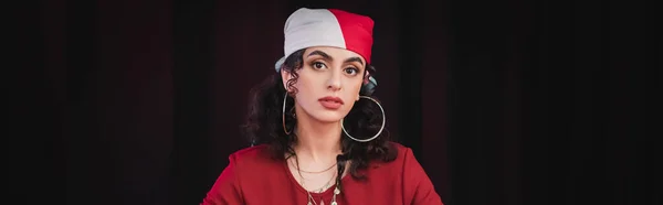 Gypsy fortune teller looking at camera isolated on black, banner — Stock Photo