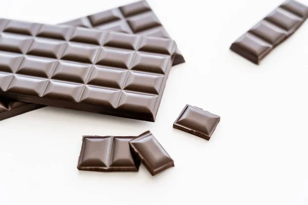 High angle view of dark chocolate on white background — Stock Photo