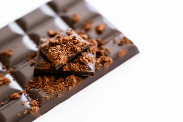 Close up view of cocoa powder on blurred chocolate on white background with copy space — Photo de stock