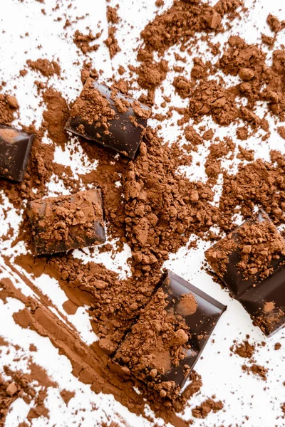 Top view of natural cocoa powder on chocolate on white background — Photo de stock