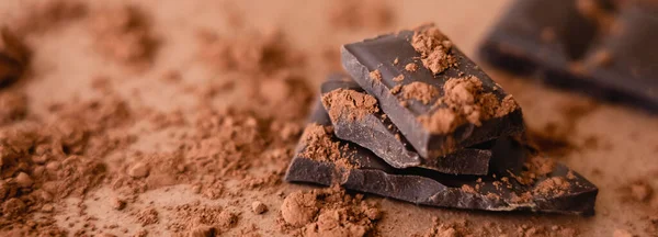 Close up view of natural chocolate and cocoa on brown background, banner — Stock Photo