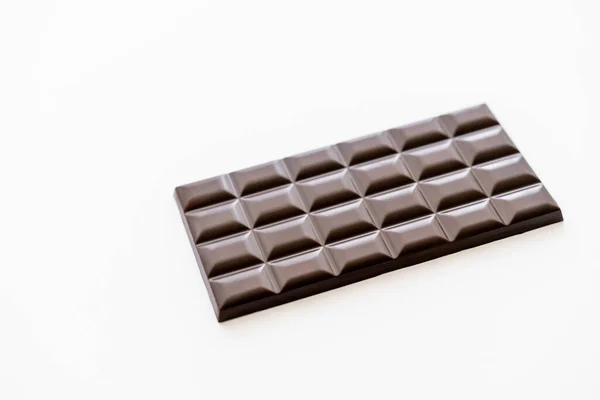 High angle view of brown chocolate bar isolated on white — Stock Photo