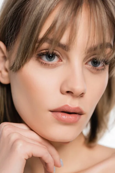 Young woman with bangs and blue eyes isolated on white — Stock Photo