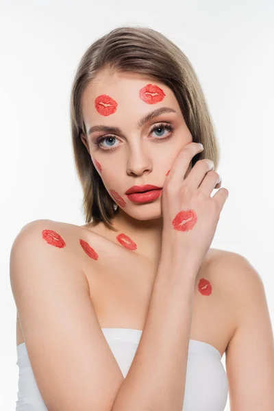 Red kiss prints on cheeks and body of pretty woman isolated on white — Photo de stock