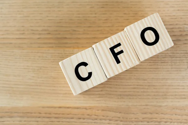 Top view of wooden cubes with cfo letters on desk — Stock Photo