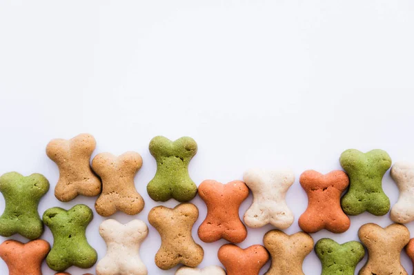 Flat lay of bone shaped cookies isolated on white — Stock Photo