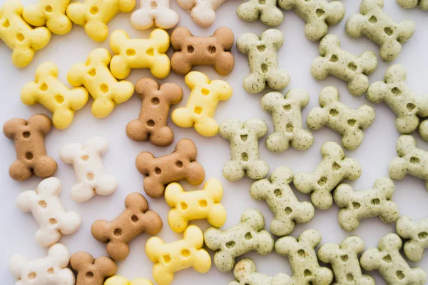 Top view of bone shaped biscuits for pet isolated on white — Stock Photo