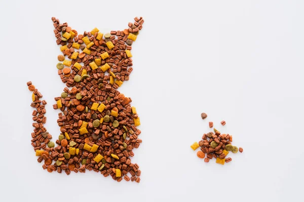 Top view of shape of cat made of pet food isolated on white — Stock Photo