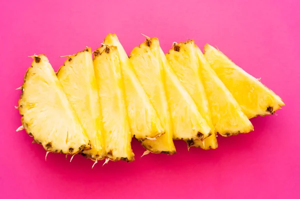 Top view of ripe pineapple on pink surface — Stock Photo
