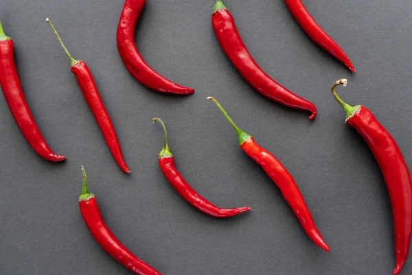 Top view of chili peppers on black background — Stock Photo