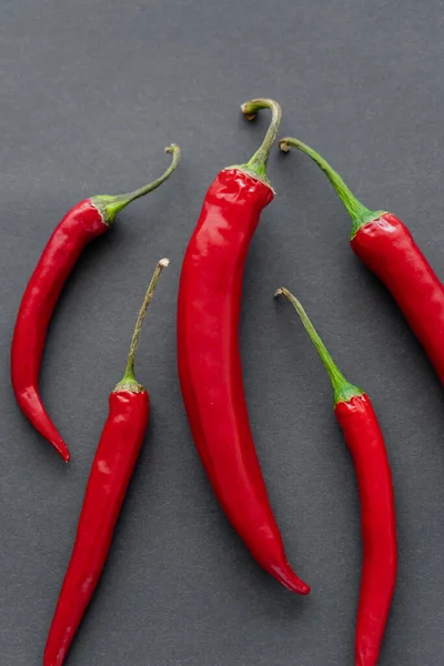 Top view of chili peppers on black background — Stock Photo
