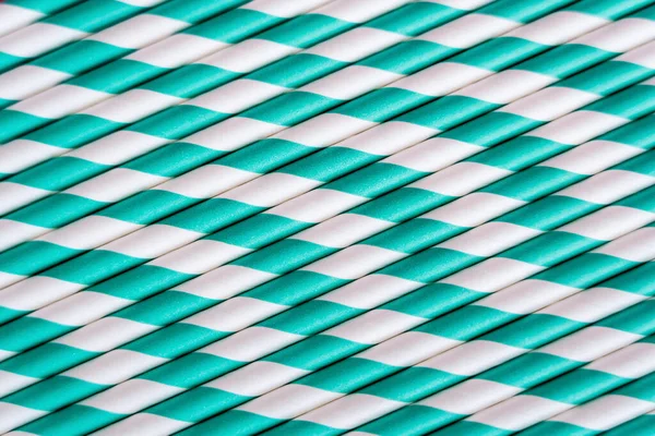 Top view of striped blue and white straws as backdrop — Foto stock