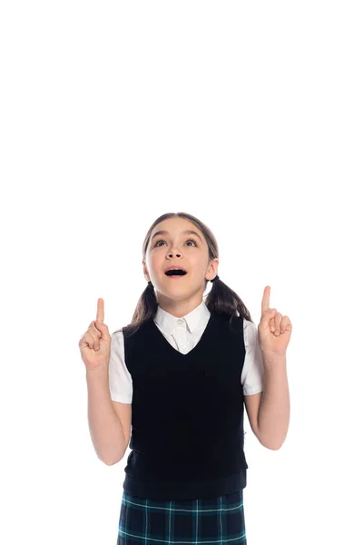 Excited schoolgirl pointing with fingers isolated on white — Stock Photo