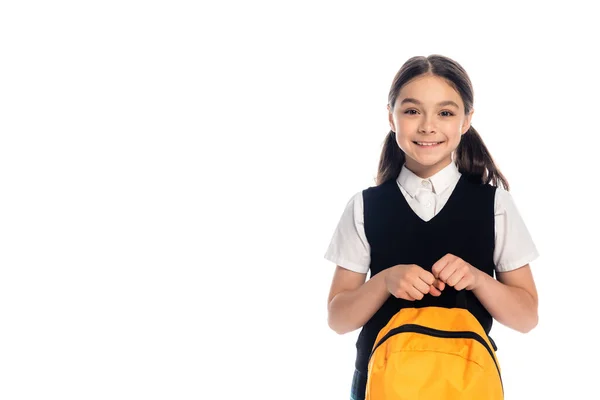 Positive schoolkid holding backpack and looking at camera isolated on white — Stock Photo