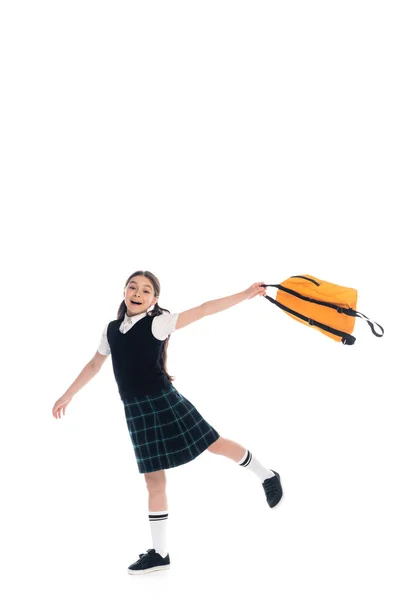 Glückliche Preteen Schulkind im Rock hält Rucksack auf weißem Hintergrund — Stockfoto