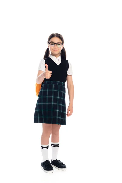 Full length of schoolkid with backpack showing like gesture on white background — Stock Photo