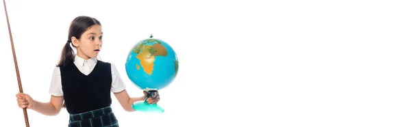Amazed schoolchild holding pointer and looking at globe isolated on white, banner — Stock Photo