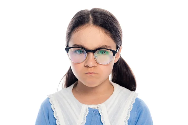 Portrait of angry schoolgirl in eyeglasses looking at camera isolated on white — Stock Photo