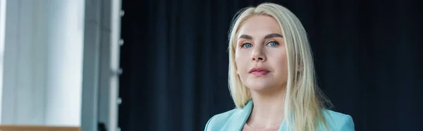 Blonde psychologist looking at camera in consultation room, banner — Stock Photo