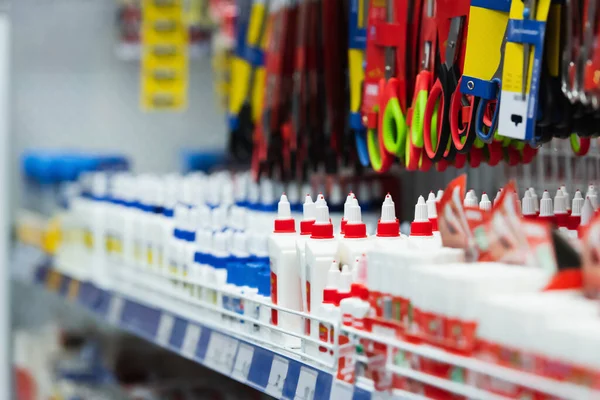 Assortment of scissors and glue in stationery shop — Stockfoto