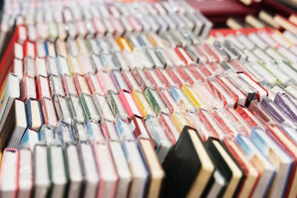 Variety of notebooks in stationery shop on blurred background — Fotografia de Stock